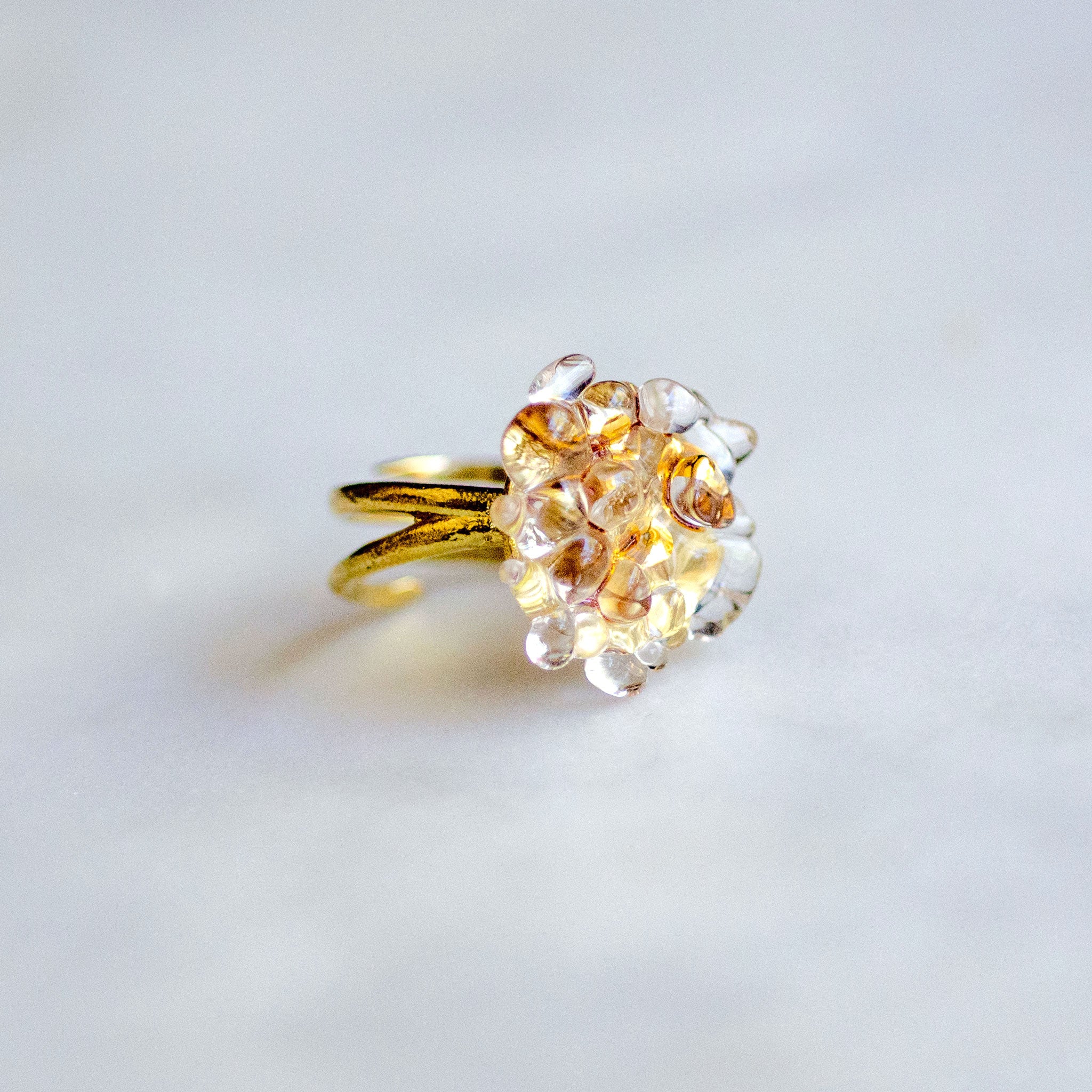 Glass and brass adjustable ring with 22 karat gold luster